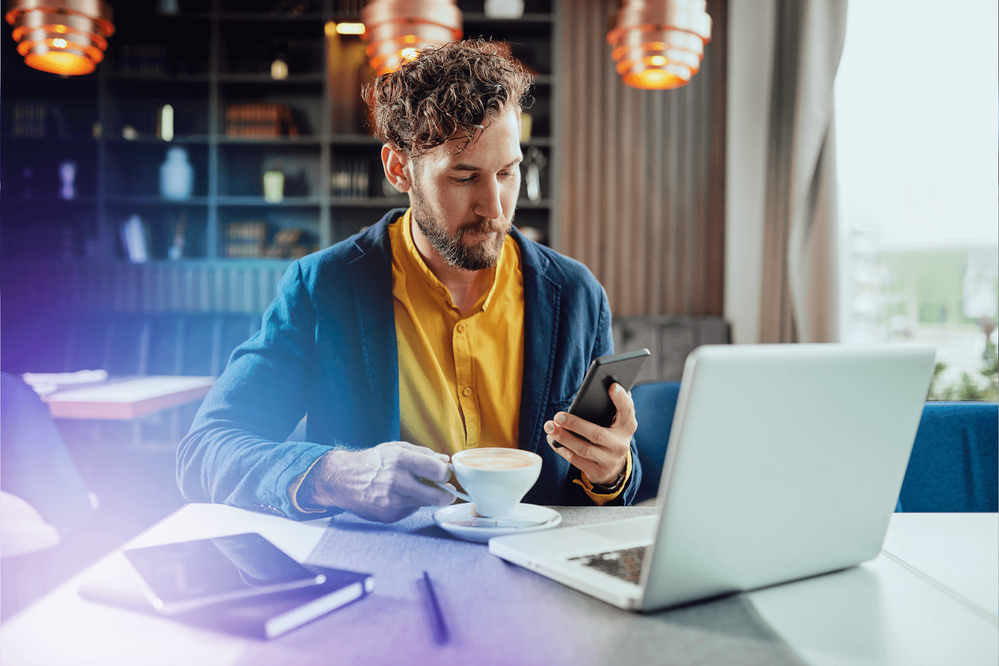 businessman-using-smart-phone-and-drinking-coffee-1151968369.png