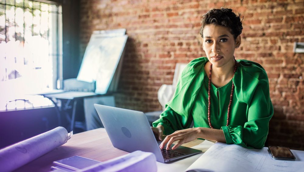 businesswoman-looking-over-architecture-blueprints-in-office-1210332659-hero-large[1].jpg