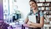 cheerful-mid-adult-waitress-holding-digital-tablet-at-cafe-1319658317-hero[1].jpg